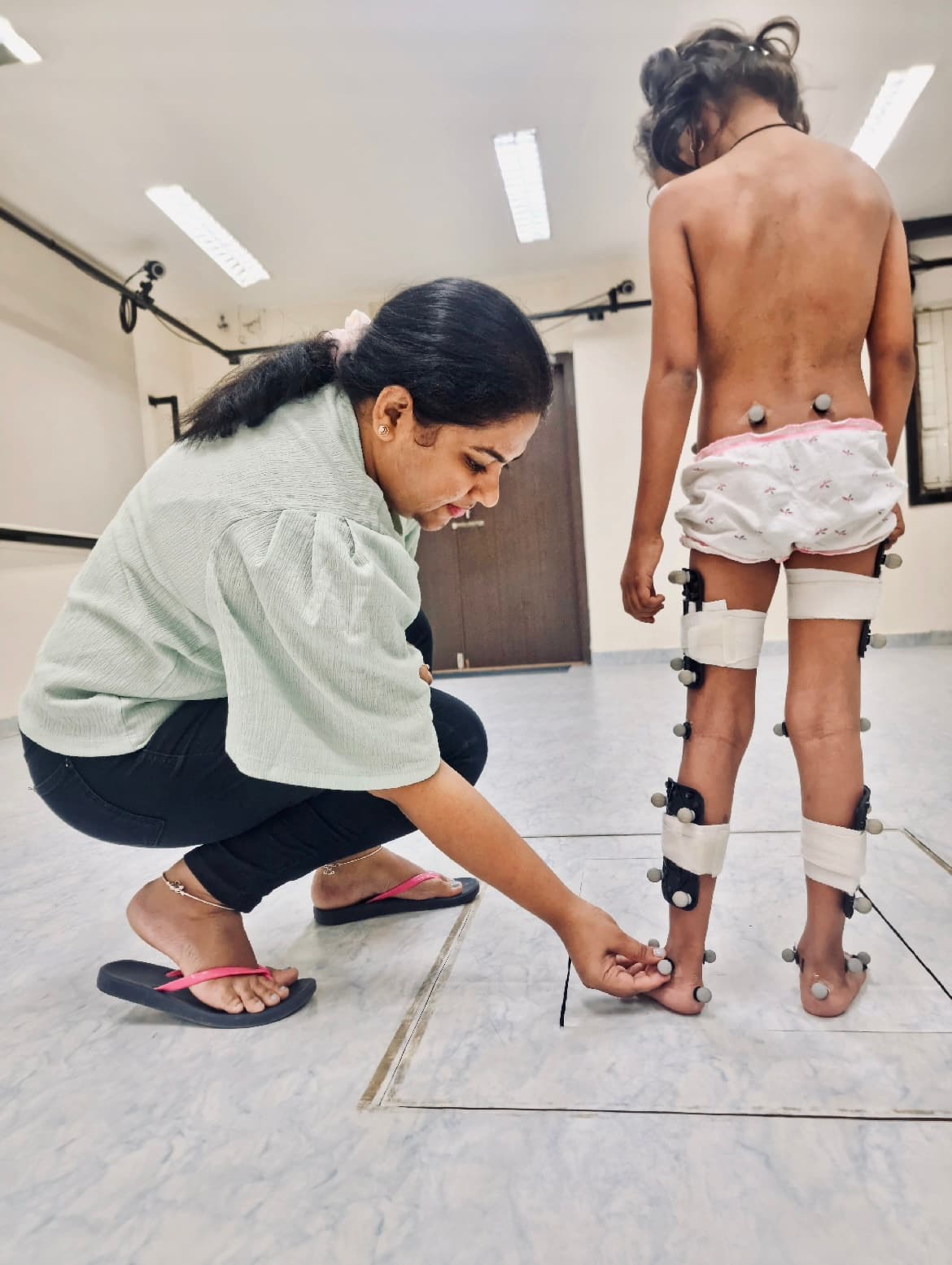 Dr. Mayuri Gad performing a clinical 3D gait analysis assessment on a patient